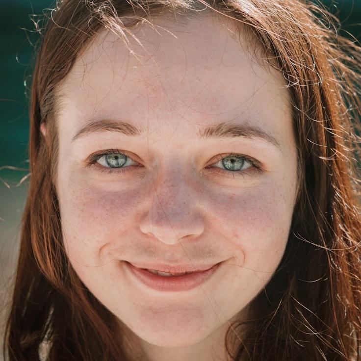 Kaveri Mehta, Lead Design Curator at Isle Paper Quartz, reviewing corporate floral arrangements