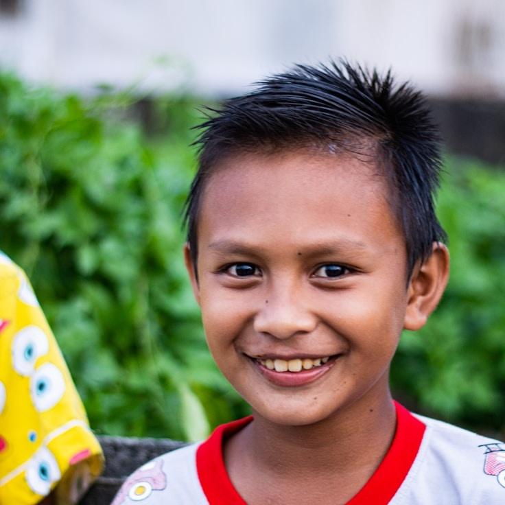 Avery Singh, Lead Design Curator at Isle Paper Quartz, reviewing corporate floral arrangements